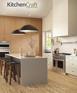 neutral kitchen with white and wooden cabinetry surrounding grey slab island