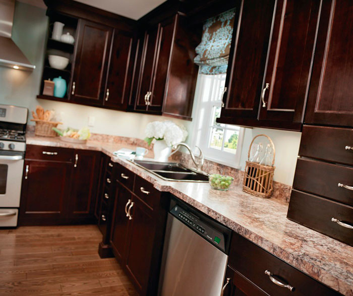 Alder cabinets in casual kitchen by Kitchen Craft Cabinetry