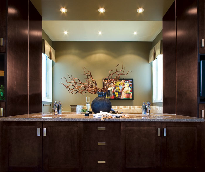 Espresso shaker cabinets in bathroom by Kitchen Craft Cabinetry